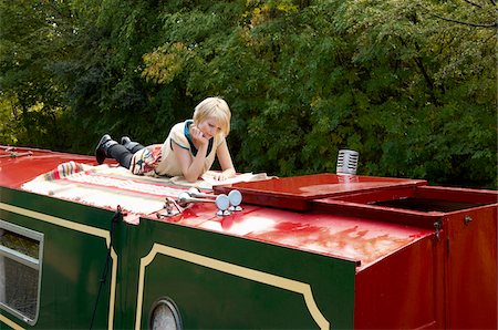 simsearch:600-03361696,k - Woman Reading on Boat Stock Photo - Premium Royalty-Free, Code: 600-01172825