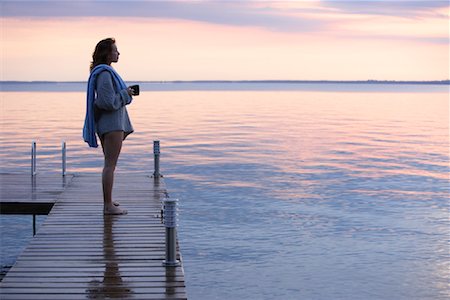 people warm color cool color - Woman on Dock by Water Stock Photo - Premium Royalty-Free, Code: 600-01172985