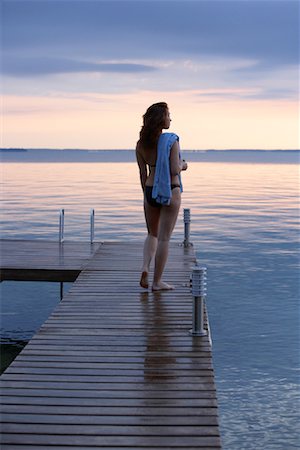 Woman on Dock by Water Stock Photo - Premium Royalty-Free, Code: 600-01172989