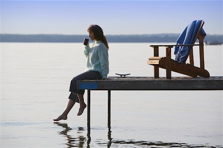 empty chair on dock - Woman Relaxing on Dock Stock Photo - Premium Royalty-Free, Code: 600-01172996
