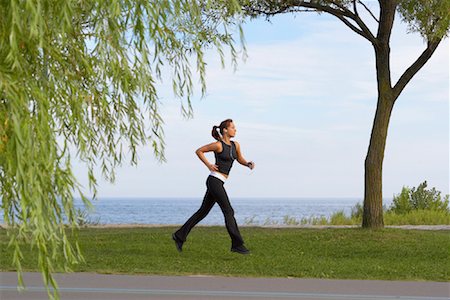 simsearch:700-03568044,k - Woman Running in Park Foto de stock - Sin royalties Premium, Código: 600-01173015