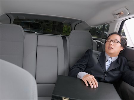 Businessman Sleeping in Car Stock Photo - Premium Royalty-Free, Code: 600-01173826