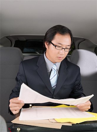 simsearch:600-01173838,k - Businessman Working in Car Foto de stock - Sin royalties Premium, Código: 600-01173831