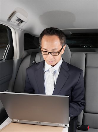 simsearch:600-01173838,k - Businessman Working in Car Foto de stock - Sin royalties Premium, Código: 600-01173865