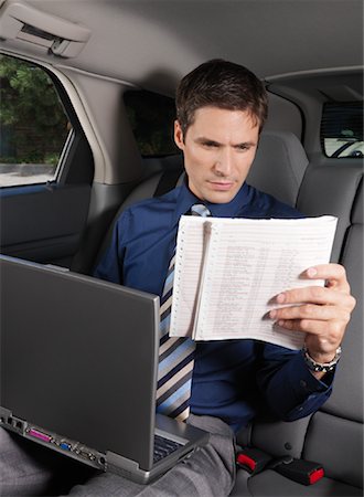Businessman Working in Car Stock Photo - Premium Royalty-Free, Code: 600-01173892
