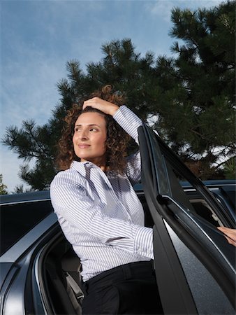 Woman Getting Out of Car Stock Photo - Premium Royalty-Free, Code: 600-01173948