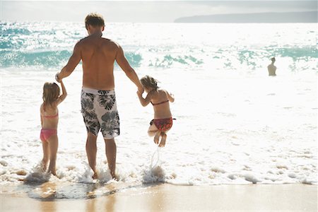 Father With Children at the Beach Stock Photo - Premium Royalty-Free, Code: 600-01184414