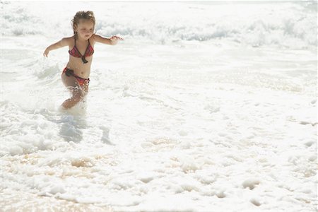 single caucasian girls in hawaii - Little Girl Running on the Beach Stock Photo - Premium Royalty-Free, Code: 600-01184415