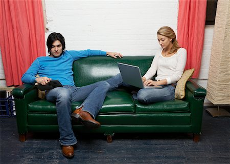 Portrait of Couple on Sofa Stock Photo - Premium Royalty-Free, Code: 600-01184560