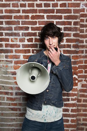 simsearch:600-01695485,k - Young Man Holding Megaphone Stock Photo - Premium Royalty-Free, Code: 600-01184626