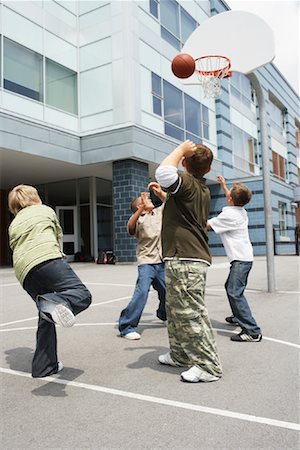 simsearch:600-01764819,k - Boys Playing Basketball Fotografie stock - Premium Royalty-Free, Codice: 600-01184642