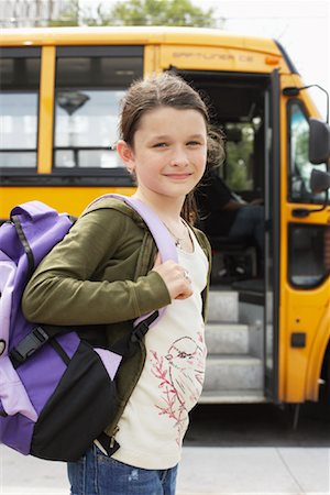 Portrait of Girl by School Bus Stock Photo - Premium Royalty-Free, Code: 600-01184677