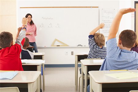 school boy hand up raised - Students and Teacher in Classroom Stock Photo - Premium Royalty-Free, Code: 600-01184694