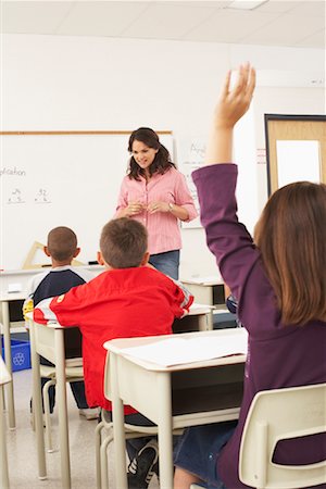 students with hands raised in classroom with female teacher - Students and Teacher in Classroom Stock Photo - Premium Royalty-Free, Code: 600-01184697