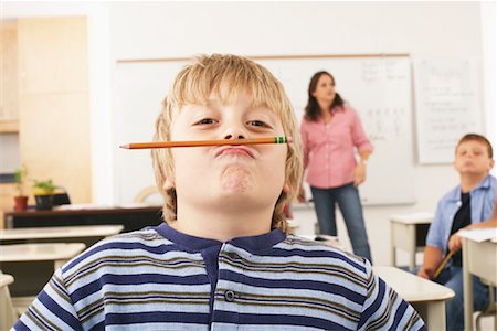 Étudiant Goofing autour en salle de classe Photographie de stock - Premium Libres de Droits, Code: 600-01184713