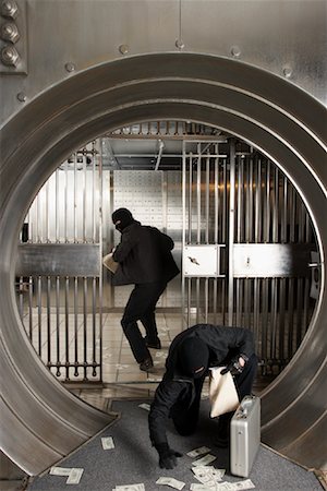 financial crime bank vault - Thieves Robbing Bank Stock Photo - Premium Royalty-Free, Code: 600-01185349