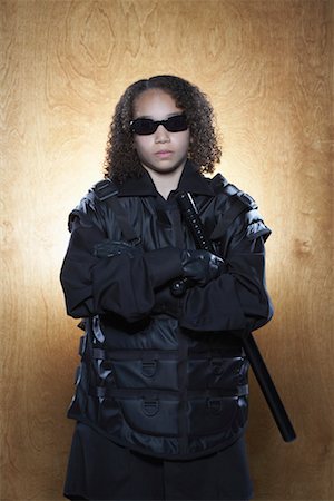 simsearch:700-02428669,k - Portrait of Girl Dressed as Police Officer Foto de stock - Royalty Free Premium, Número: 600-01183030