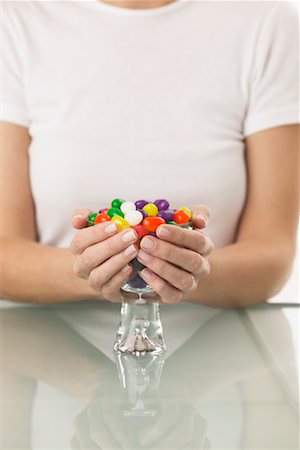 simsearch:700-00748140,k - Woman Holding Bowl of Jelly Beans Stock Photo - Premium Royalty-Free, Code: 600-01183049