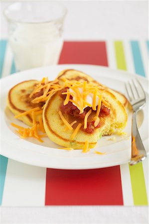 simsearch:600-03445187,k - Pancakes on Plate with Cheese and Sour Cream Fotografie stock - Premium Royalty-Free, Codice: 600-01183726
