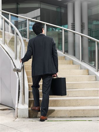 people walking up stairs from behind - Man Ascending Staircase Stock Photo - Premium Royalty-Free, Code: 600-01194816