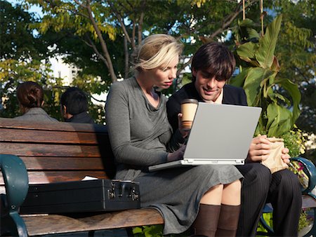 simsearch:600-01593612,k - Man and Woman on Park Bench Looking at Laptop Computer Stock Photo - Premium Royalty-Free, Code: 600-01194860