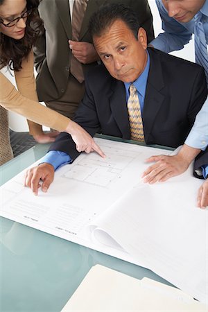 Business People Looking at Blueprints Stock Photo - Premium Royalty-Free, Code: 600-01195301