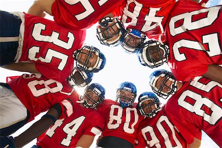 Football Players in Huddle Stock Photo - Premium Royalty-Free, Code: 600-01196518