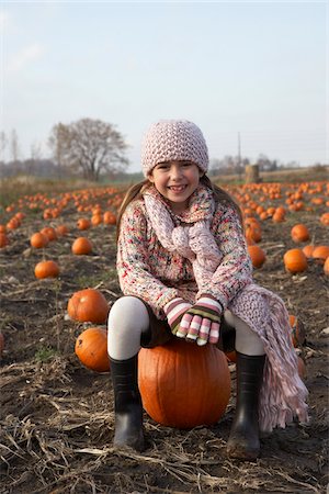 Portrait of  Girl in Pumpkin Patch Stock Photo - Premium Royalty-Free, Code: 600-01196598