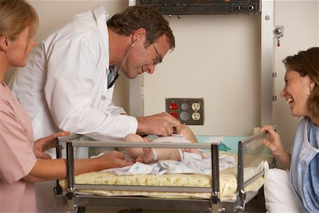 doctor woman heartbeat - Doctor Examining Newborn Stock Photo - Premium Royalty-Free, Code: 600-01199646