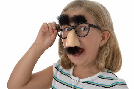 simsearch:700-02346370,k - Girl Wearing Groucho Glasses Fotografie stock - Premium Royalty-Free, Codice: 600-01200315