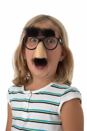 simsearch:700-02346370,k - Girl Wearing Groucho Glasses Fotografie stock - Premium Royalty-Free, Codice: 600-01200316