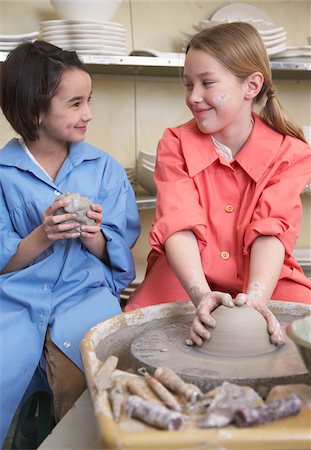 people looking at each other - Girls at Potter's Wheel Stock Photo - Premium Royalty-Free, Code: 600-01200422