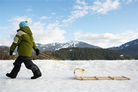 Boy Pulling Toboggan, Whistler, British Columbia, Canada Stock Photo - Premium Royalty-Free, Code: 600-01224154