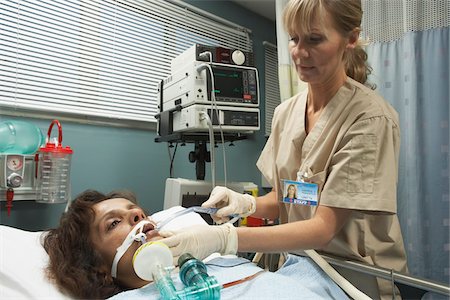 Nurse Tending to Patient Stock Photo - Premium Royalty-Free, Code: 600-01223651