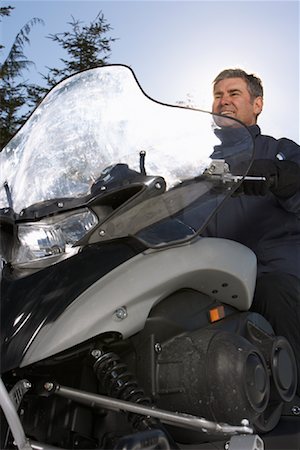 people on snowmobiles - Man on Snowmobile Stock Photo - Premium Royalty-Free, Code: 600-01235162