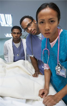 pictures of a sick black woman at the hospital - Medical Team Stock Photo - Premium Royalty-Free, Code: 600-01235413