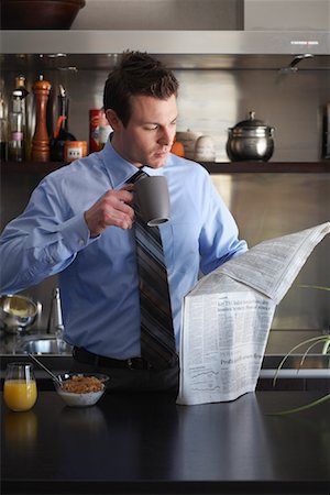 simsearch:600-01235298,k - Businessman Eating Breakfast, Reading Newspaper Stock Photo - Premium Royalty-Free, Code: 600-01235441