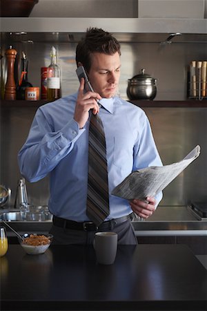 simsearch:600-01235298,k - Businessman Using Cellular Phone and Reading Newspaper During Breakfast Stock Photo - Premium Royalty-Free, Code: 600-01235442