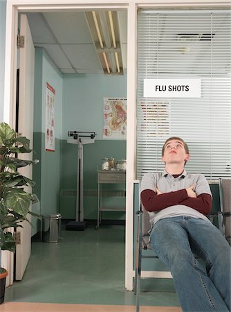 Teenaged Boy Waiting in Doctor's Office Stock Photo - Premium Royalty-Free, Code: 600-01236176
