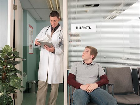 Doctor and Patient in Office Fotografie stock - Premium Royalty-Free, Codice: 600-01236177