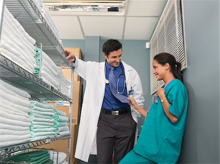 Doctor and Nurse Flirting in Supply Room Stock Photo - Premium Royalty-Free, Code: 600-01236195