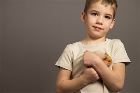 simsearch:700-01344581,k - Portrait of Boy Holding Hamster Stock Photo - Premium Royalty-Free, Code: 600-01236613