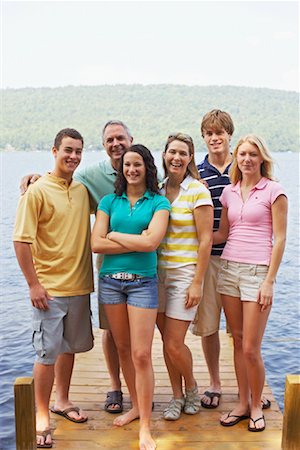 Family Standing on Dock, Belgrade Lakes, Maine, USA Stock Photo - Premium Royalty-Free, Code: 600-01236640