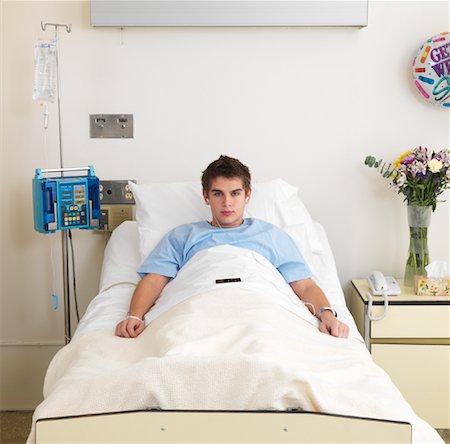 person in hospital bed overhead - Boy in Hospital Bed Stock Photo - Premium Royalty-Free, Code: 600-01248198