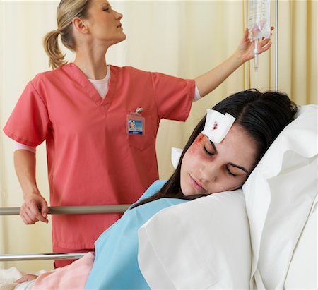 doctor checks teenage girl - Nurse Checking on Patient Stock Photo - Premium Royalty-Free, Code: 600-01248225