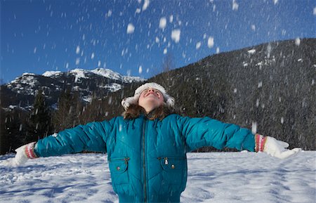 Girl Throwing Snow into Air Stock Photo - Premium Royalty-Free, Code: 600-01248309