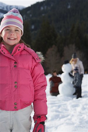 Portrait of Girl, Family in Background Stock Photo - Premium Royalty-Free, Code: 600-01248345