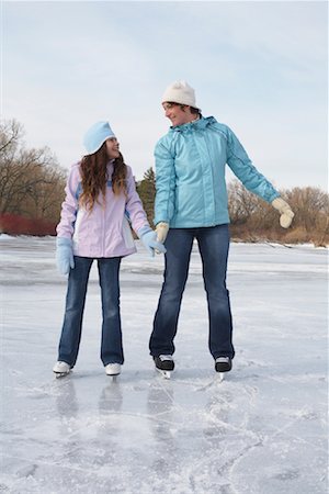 simsearch:600-01249385,k - Mother and Daughter Skating Stock Photo - Premium Royalty-Free, Code: 600-01249383