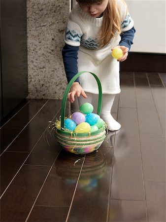 Girl Collecting Easter Eggs Stock Photo - Premium Royalty-Free, Code: 600-01260353