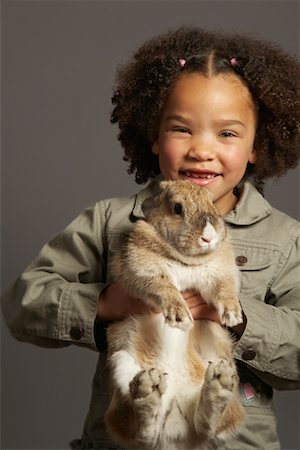 Girl Holding Rabbit Stock Photo - Premium Royalty-Free, Code: 600-01275387